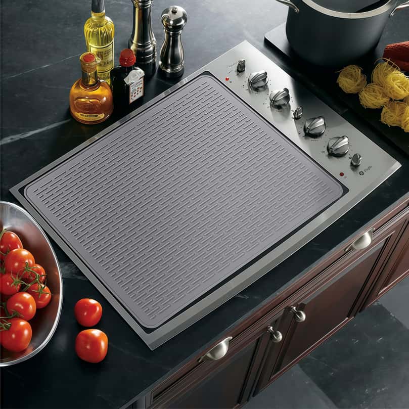 Multifunctional silicone stove mat